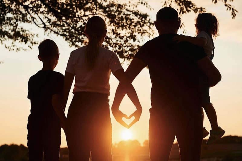 A family watching the sunset together